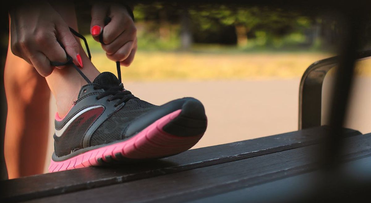 Person tying shoelaces